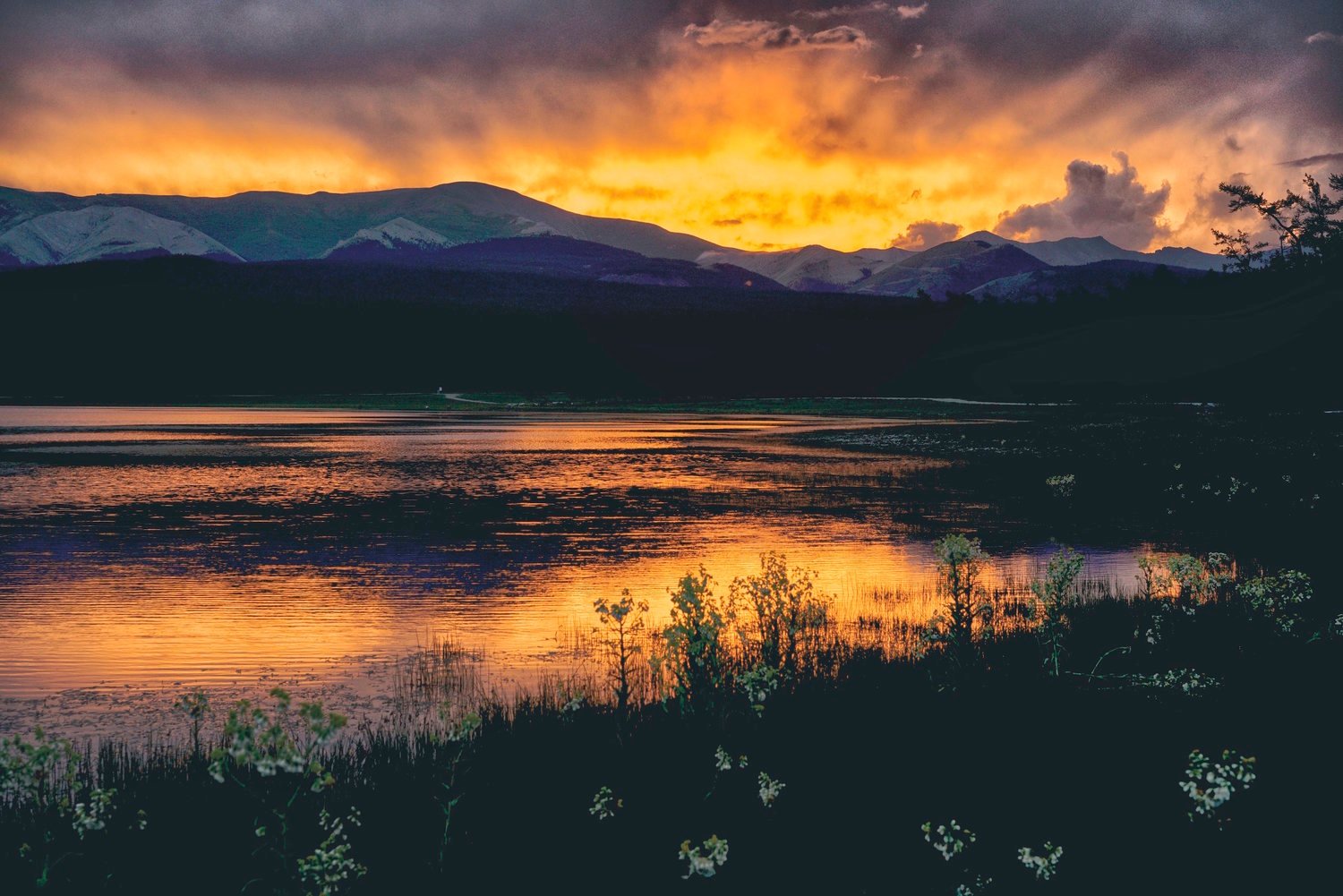 Sunset burning orange over a northern Mongolian lake