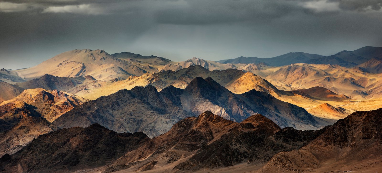 Sunlit Altai mountain range at dawn in western Mongolia
